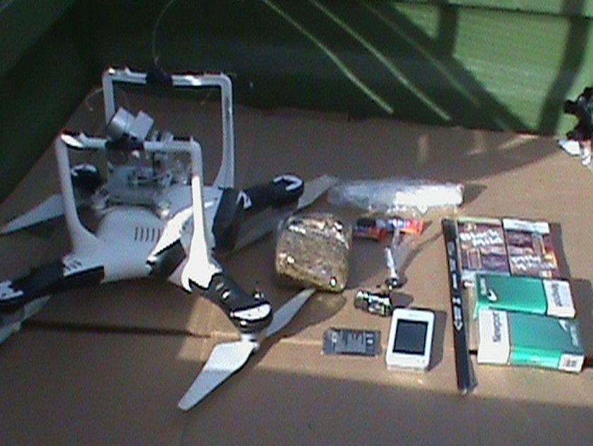 Drone smuggling drugs cell phone guns to prisons.jpg