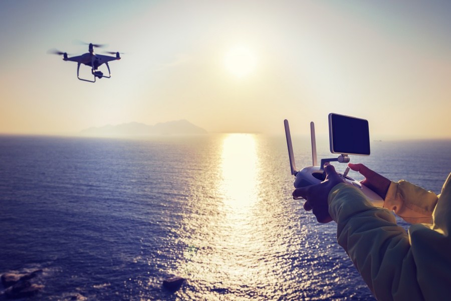 Drone with pilot over water